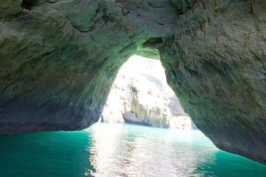 A natural rock formation with a water body beneath. 4