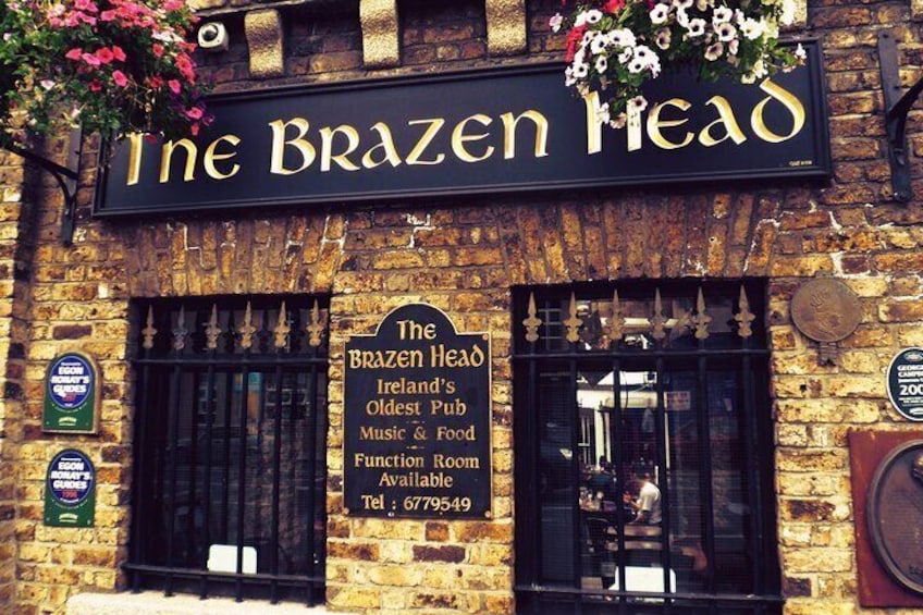 The Brazen Head, a pub with a sign stating it's Ireland's oldest pub with music and food available. 3