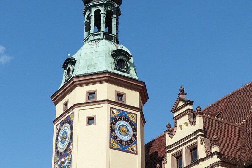 A building with a clock tower and a dome. 4