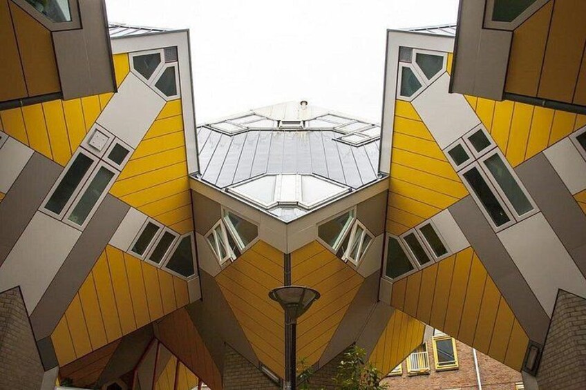 A building with a geometric facade and multiple windows. 4