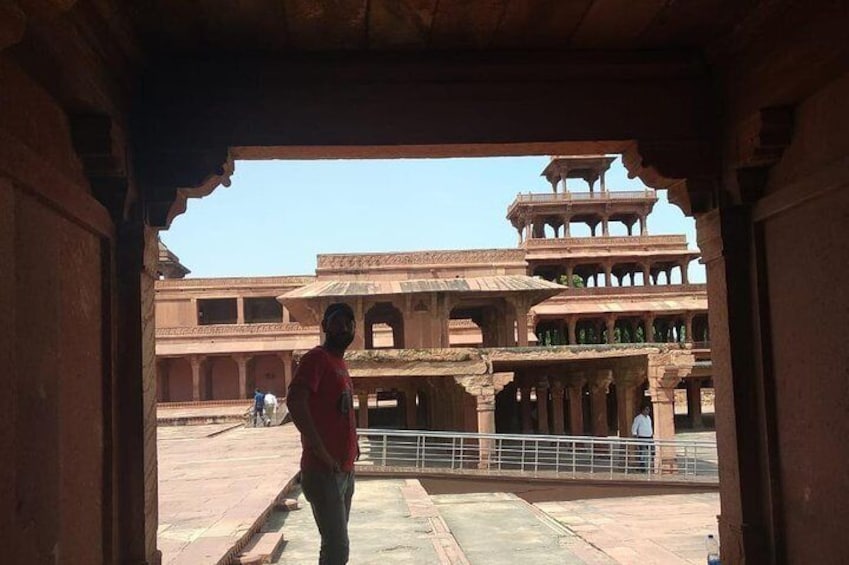An architectural structure with arched doorways and a courtyard. 1