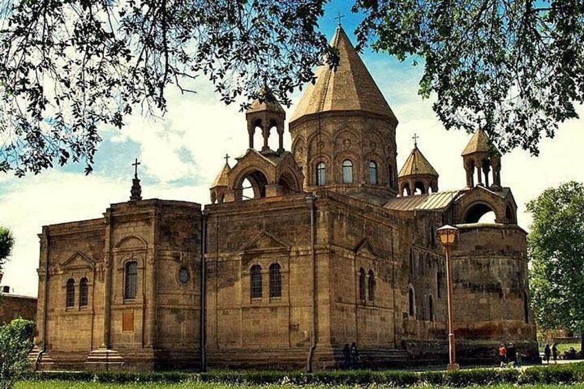 A large, historic church with multiple domes and a bell tower. 2