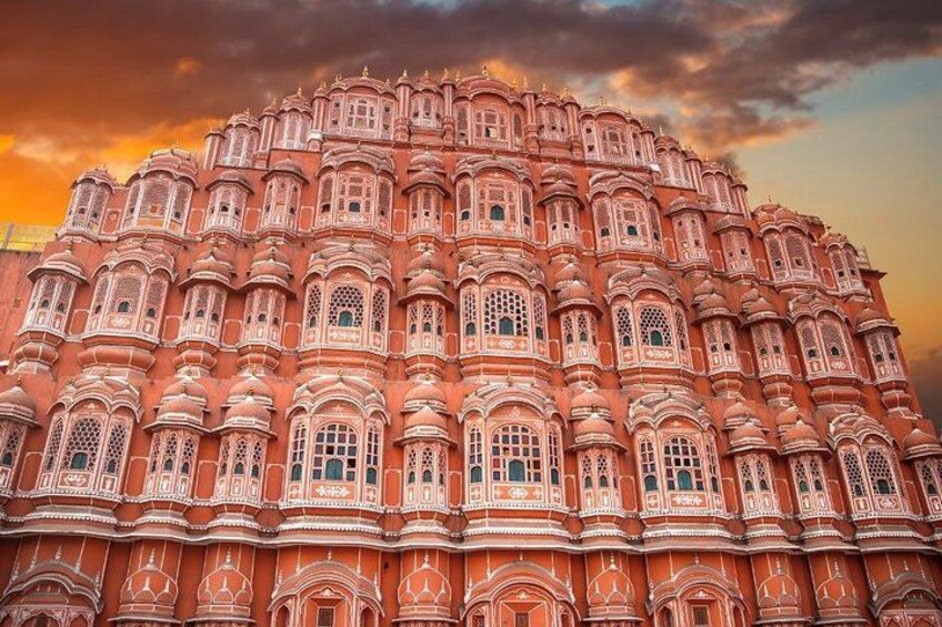 A large, ornate building with intricate architectural details and multiple windows. 3
