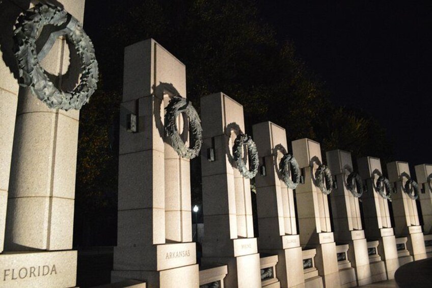 A series of stone pillars with wreaths and state names. 2