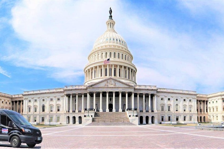 The United States Capitol building with a clear sky. 1