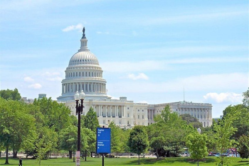 The United States Capitol building with a clear blue sky. 5