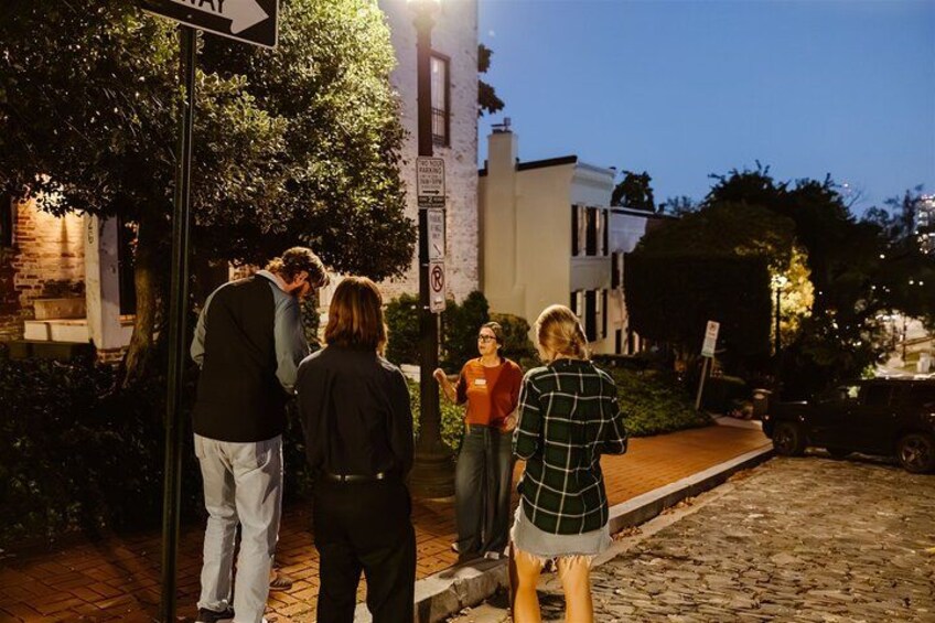 Walk cobblestoned streets of Georgetown at night. 4