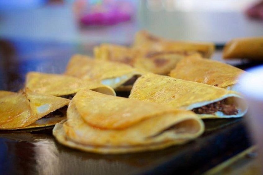 A plate of folded quesadillas. 5