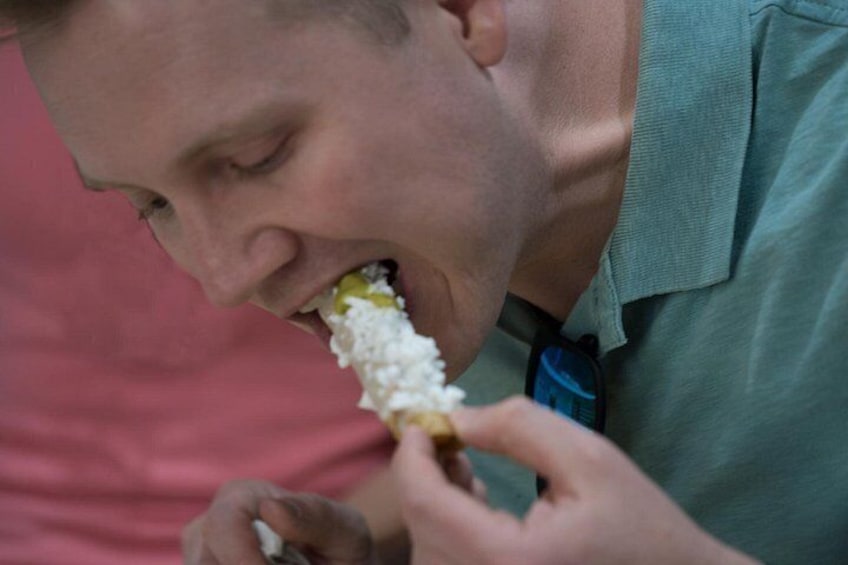 A person eating a food item. 2