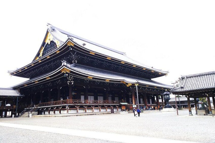 A traditional Japanese building with a curved roof and ornate details. 3