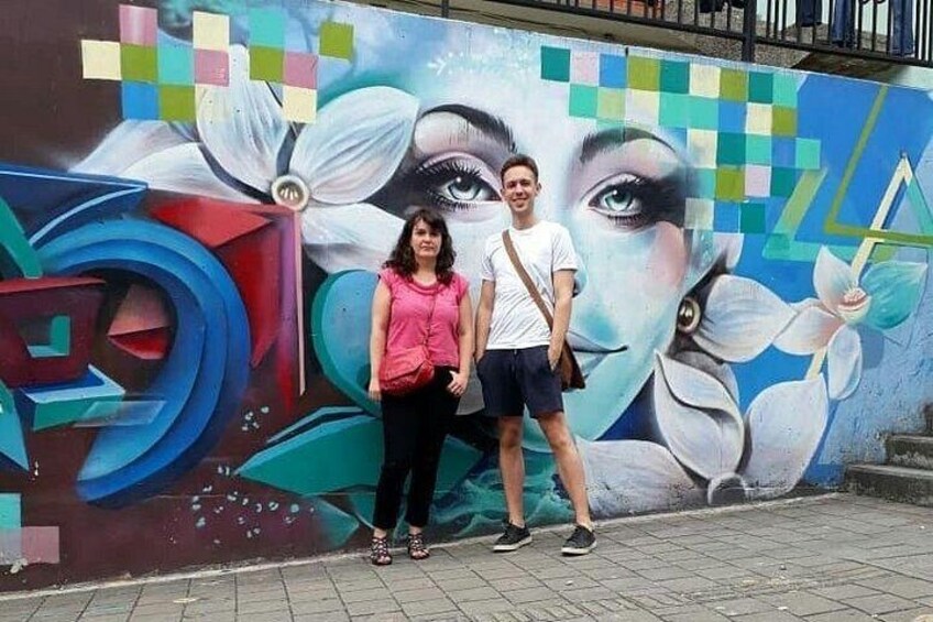 A mural with abstract shapes and a woman's face. 2