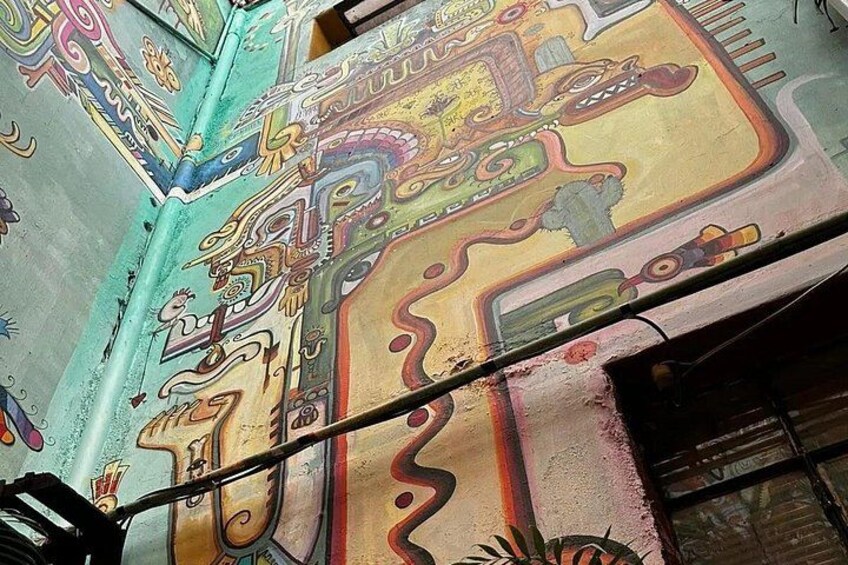 A colorful mural with intricate patterns and designs. 4
