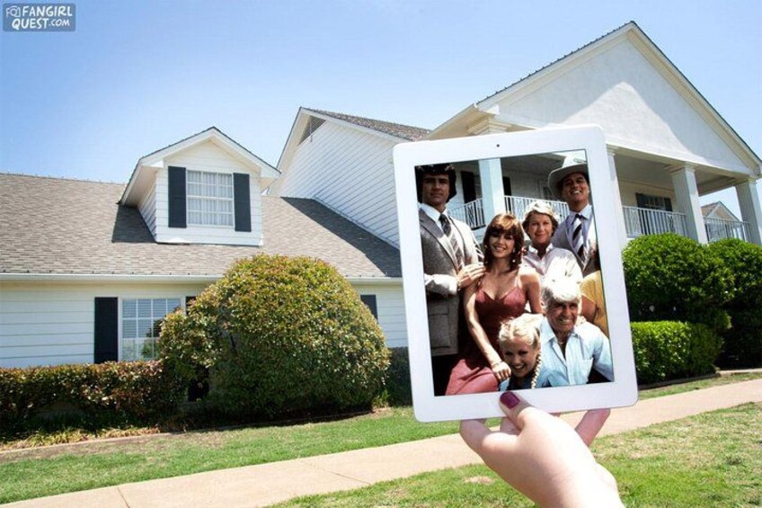 A house with a porch, a lawn, and a bush. 4