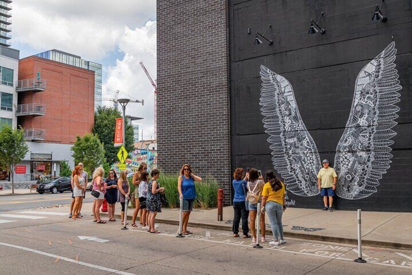 Learn about venues, shopping, and murals in the Gulch…depending on the line wait times we can definitely stop and get a picture at the Popular Angel Wing Mural! 