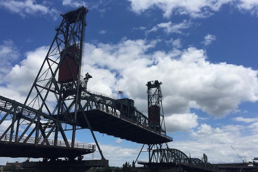 A large industrial bridge structure with multiple levels and a prominent tower. 3