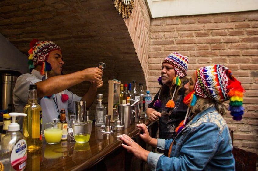 A bar setting with bottles and glasses. 2