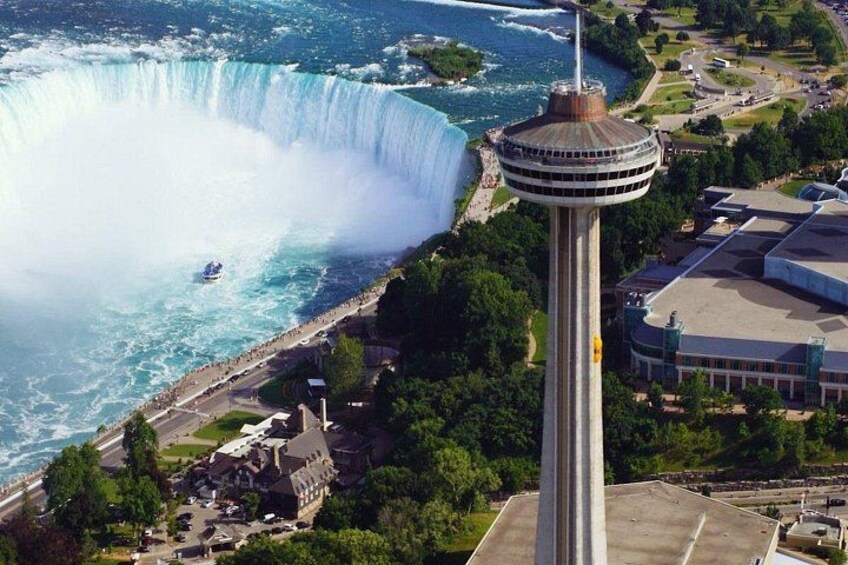 Skylon tower ride to the top of Niagara Falls Tower by yellow elevators. 3