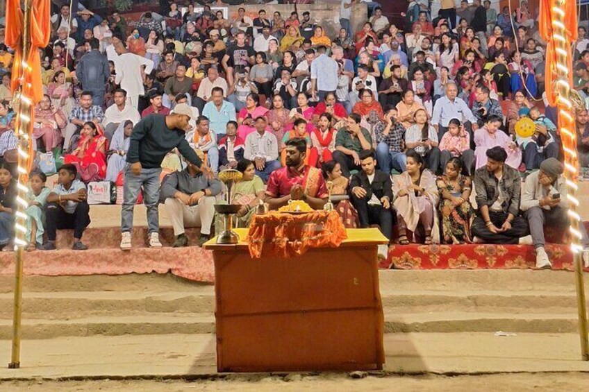 A public gathering with a stage and a crowd. 5