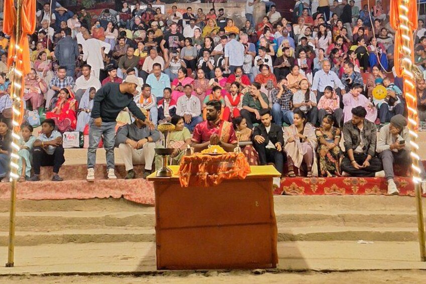 A public gathering with a stage and a crowd. 5