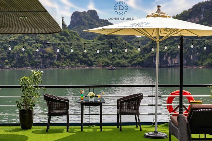 A boat deck with outdoor seating, a potted plant, and a lifebuoy. 5