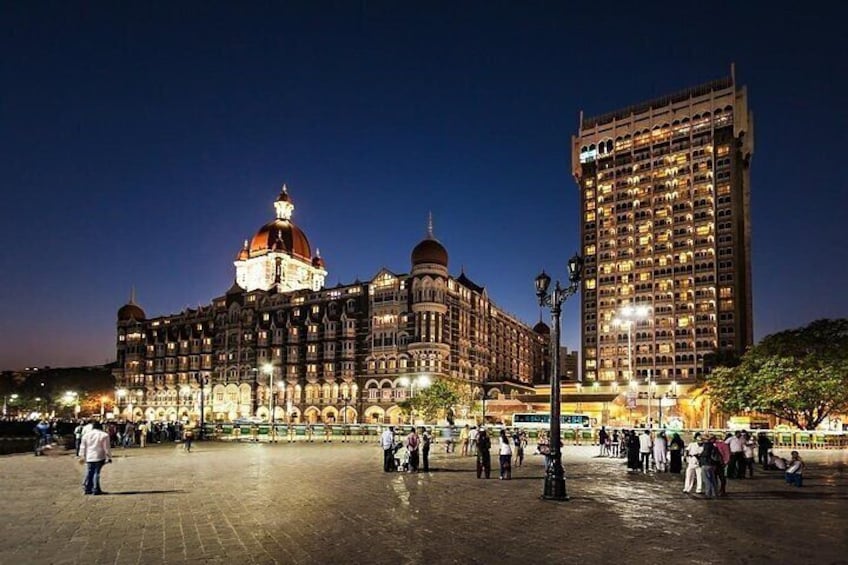 A historic building with a dome and a modern skyscraper in the background. 4
