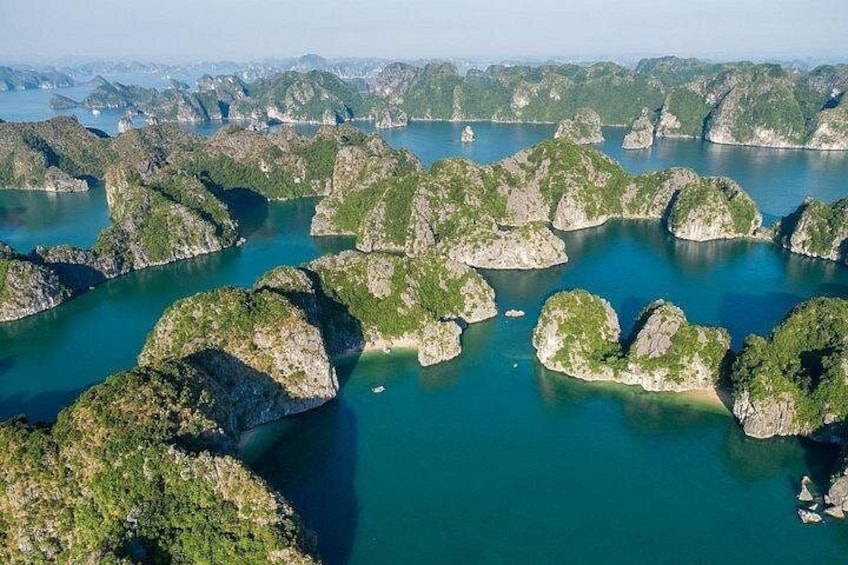 A coastal landscape with numerous small islands surrounded by turquoise waters. 2