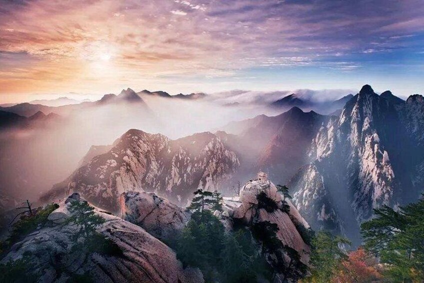 A mountainous landscape with a temple nestled among the rocks. 5