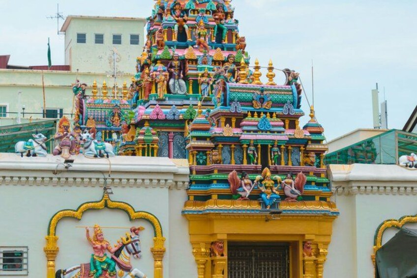 A colorful temple with intricate architecture and statues. 3