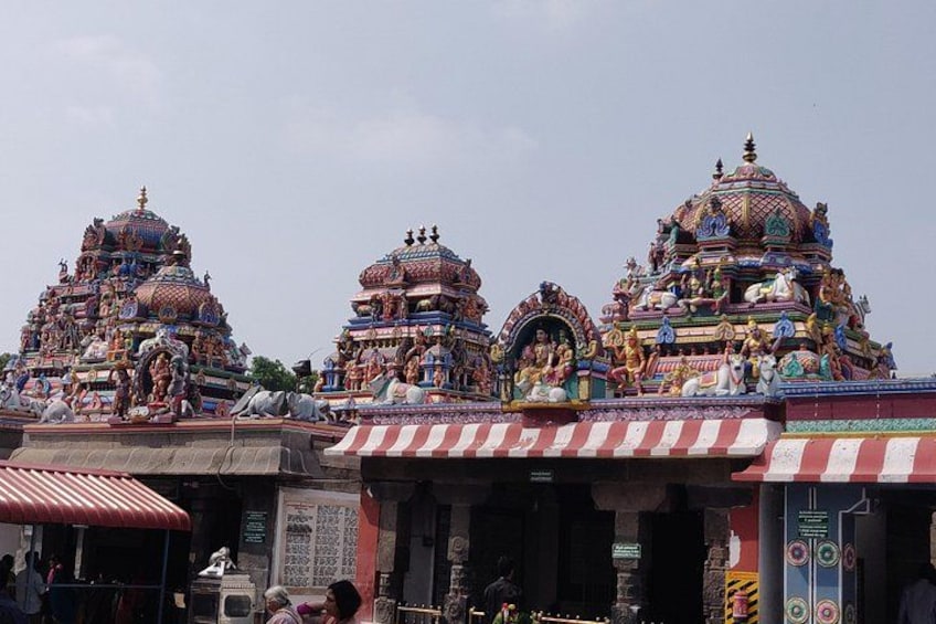 A temple with multiple domes, intricate carvings, and statues. 2