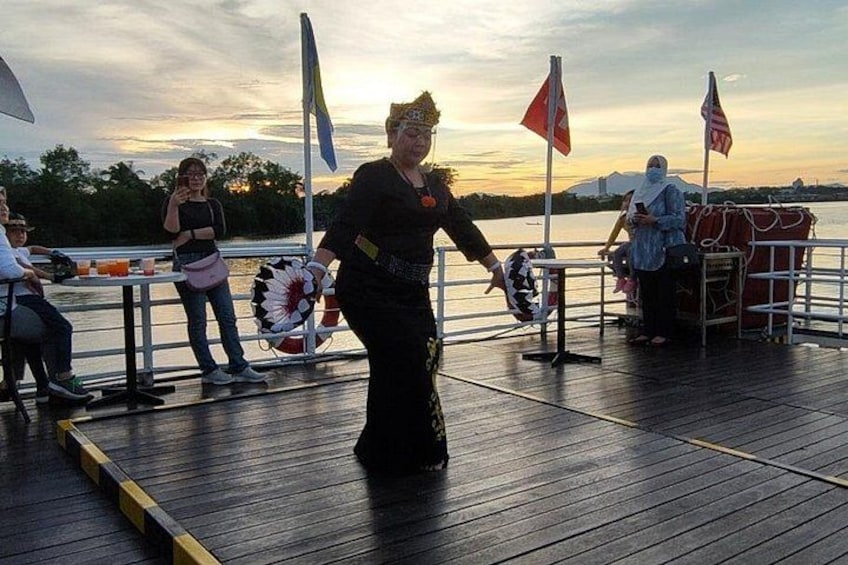 A person on a wooden dock with flags, a sunset in the background, and a calm body of water. 5