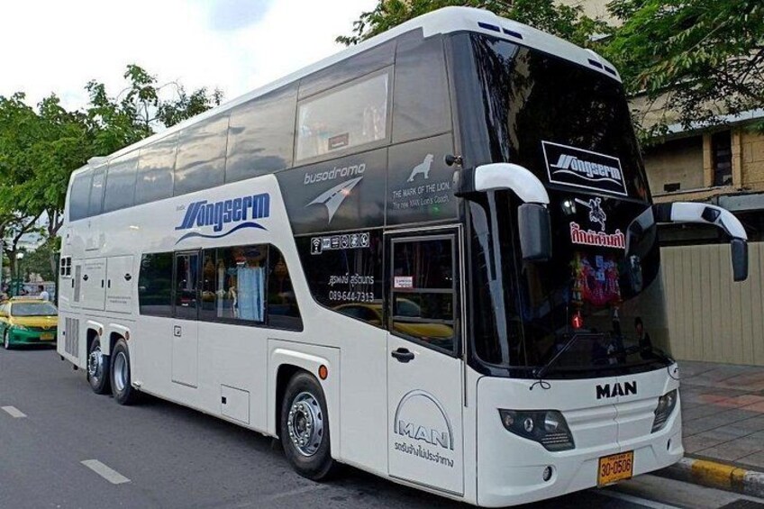 A white double-decker bus with 'Yongseem' branding parked on a street. 5