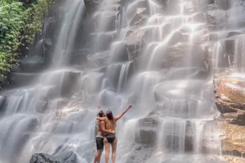 A waterfall with multiple streams cascading down a rocky cliff. 2
