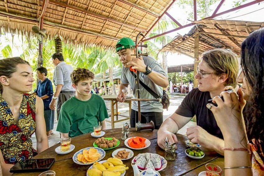 Enjoying tropical fresh fruits while listening to live traditional music 5