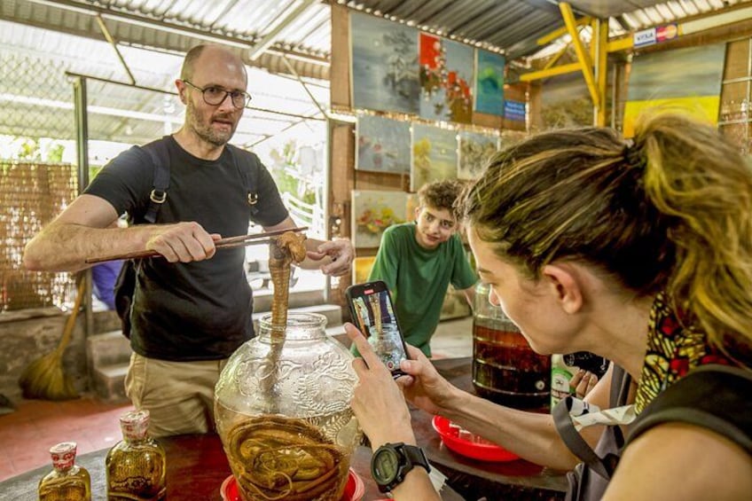 Trying some snake-wine 5