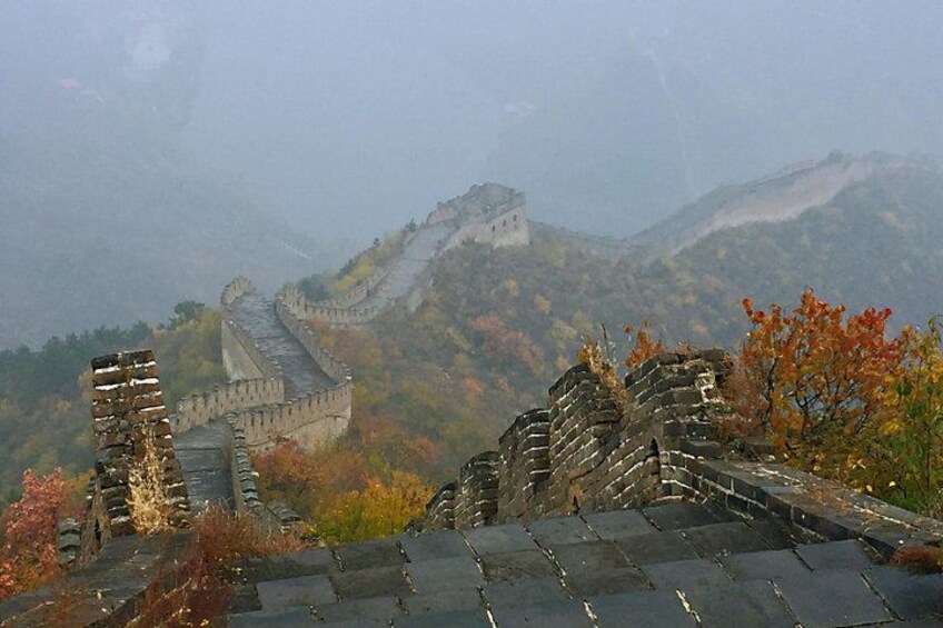 The Great Wall of China, autumn foliage, and mountainous terrain. 3