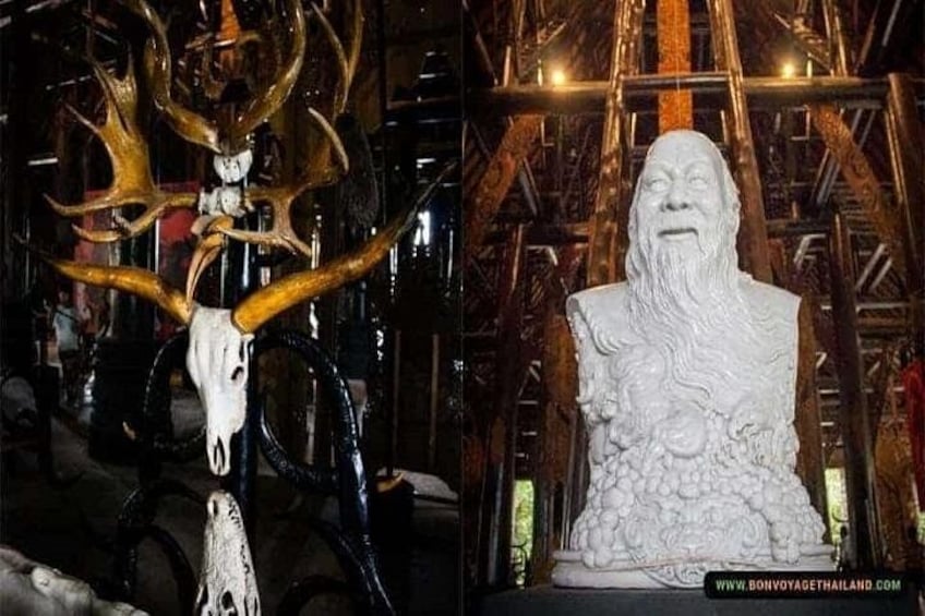 A sculpture of a bull's head with antlers and a bust of a bearded man. 3