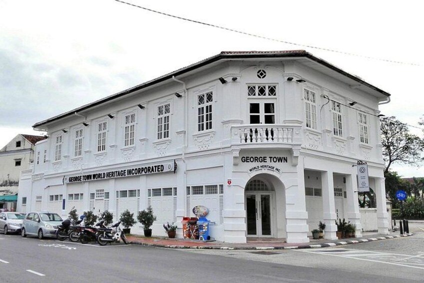 A white building with the sign 'George Town World Heritage Incorporated' and 'George Town World Heritage Inc.' 2