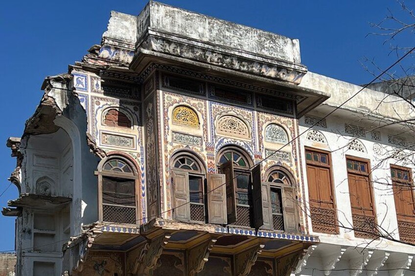 A historic building with ornate architectural details, including arched windows and decorative patterns. 2