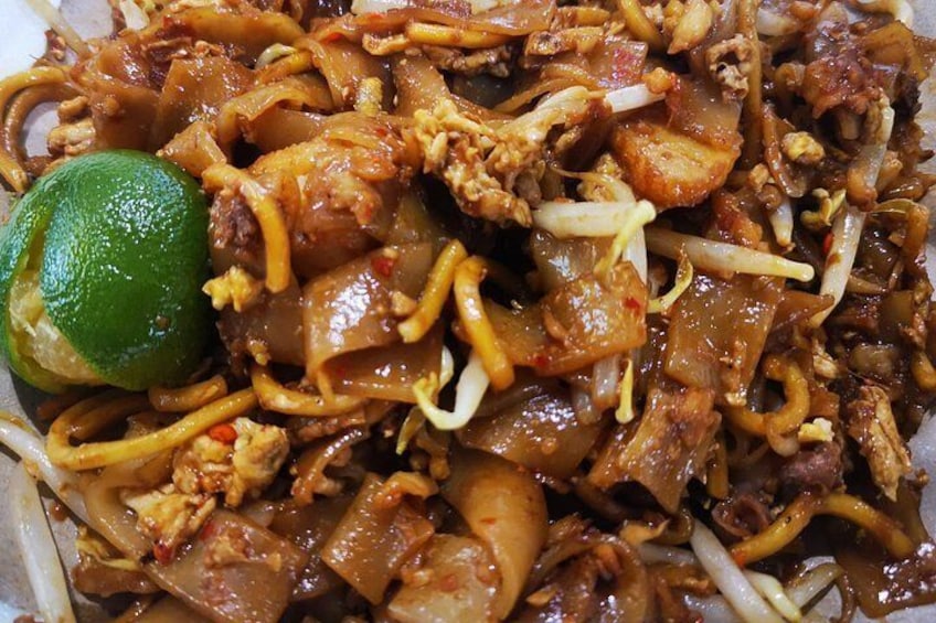 A dish of stir-fried noodles with meat and vegetables. 3
