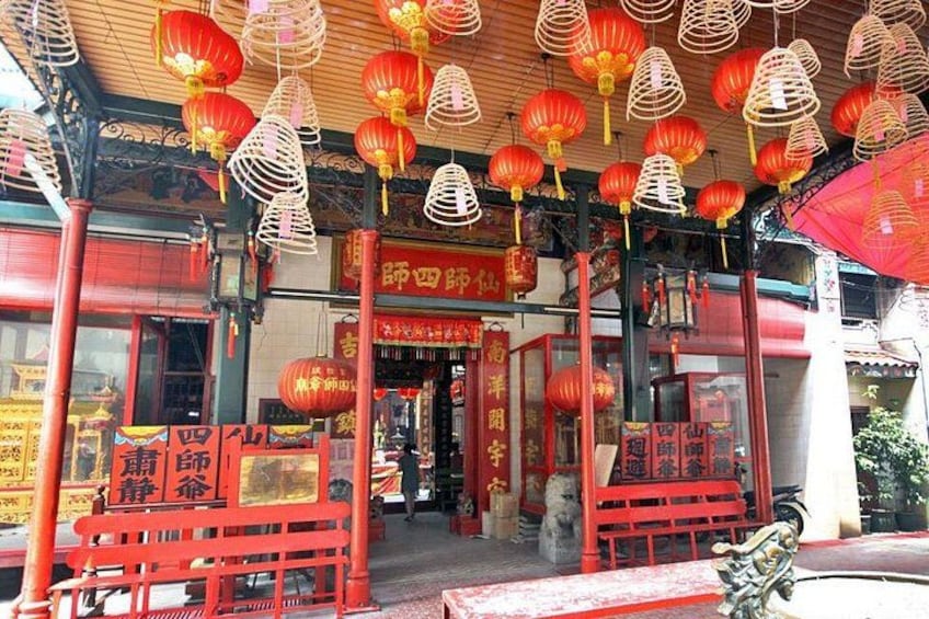 A traditional Chinese building with red lanterns and wooden beams. 4
