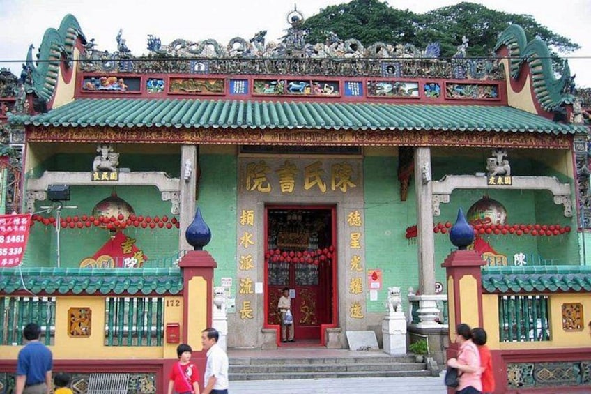 A traditional Chinese temple with ornate decorations and a red entrance. 3