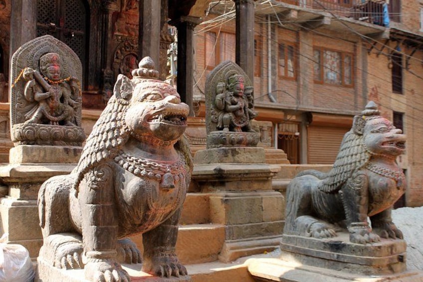 Stone lion statues at a temple entrance. 5