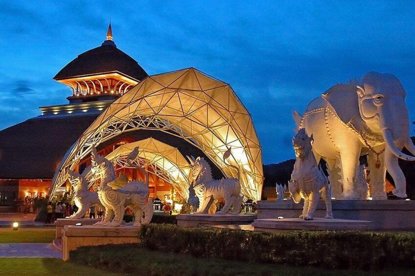 A building with a dome and a large, illuminated structure resembling a geodesic dome. 4