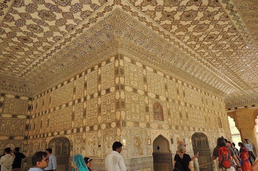 An intricately decorated building with detailed patterns and designs on the walls and ceiling. 2