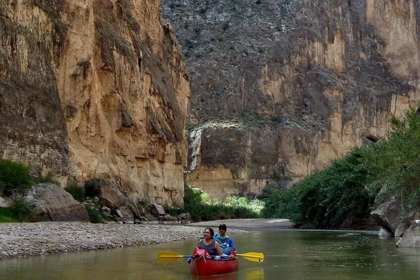 A river with a rocky canyon in the background. 5