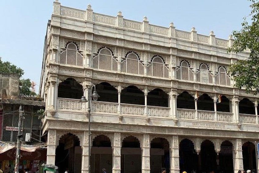 A multi-story building with ornate arches and balconies. 5
