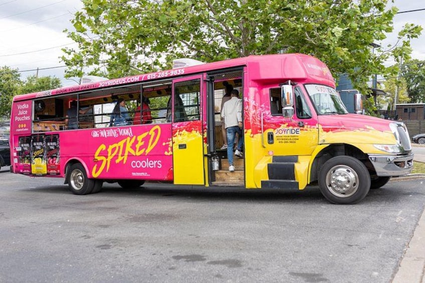 A pink and yellow food truck with the words 'SPIKED coolers' on the side. 2