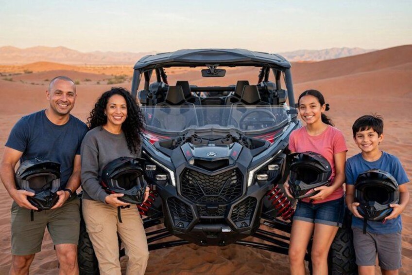 A family with a quad bike in a desert landscape. 2