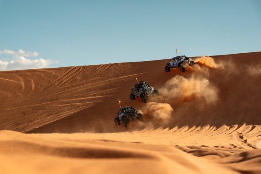 Off-road vehicles racing on a desert dune. 1