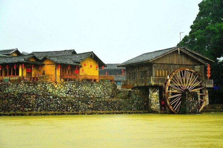 Traditional buildings with a large water wheel. 5